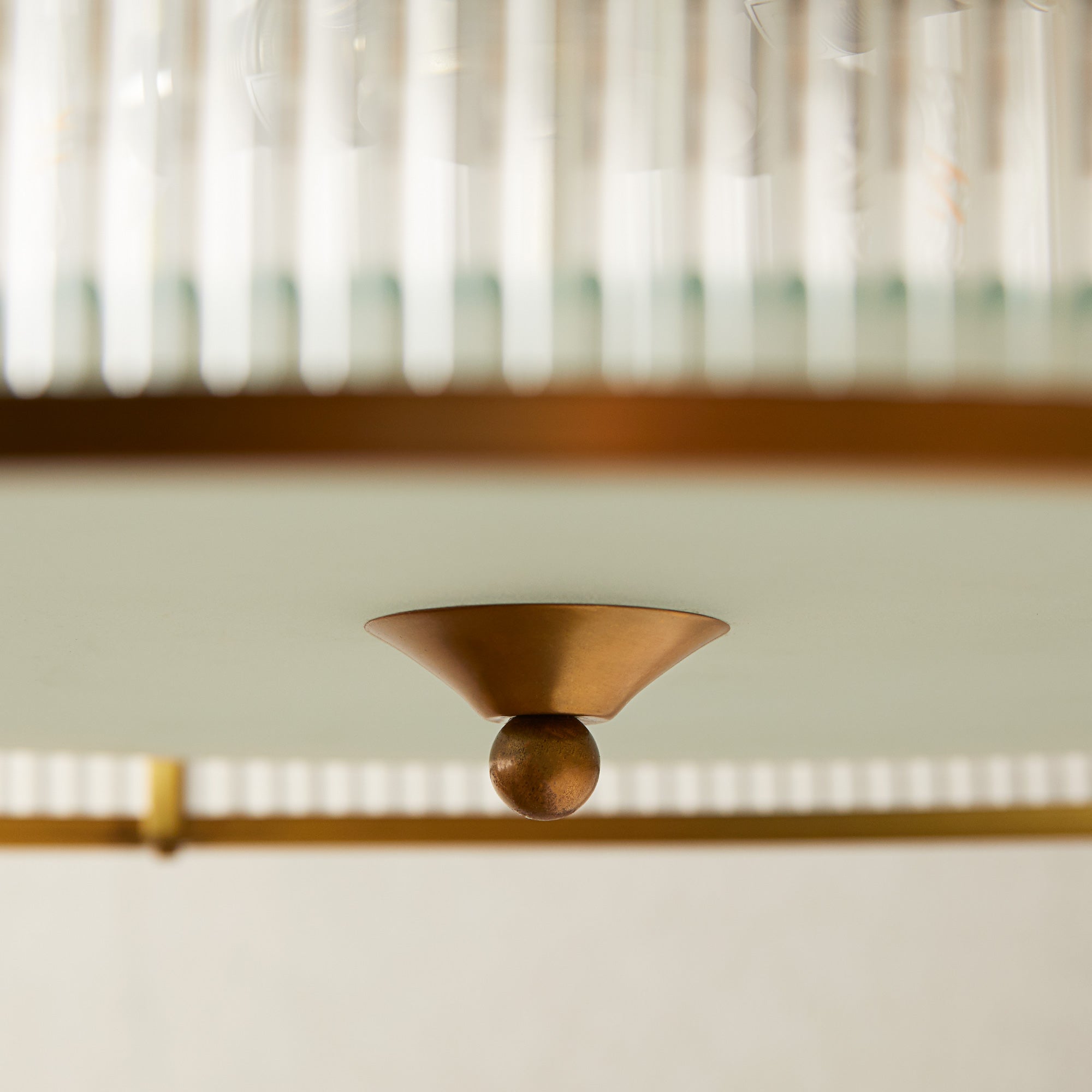 Artemis circular chandelier in brass with glass rods and frosted glass baffle