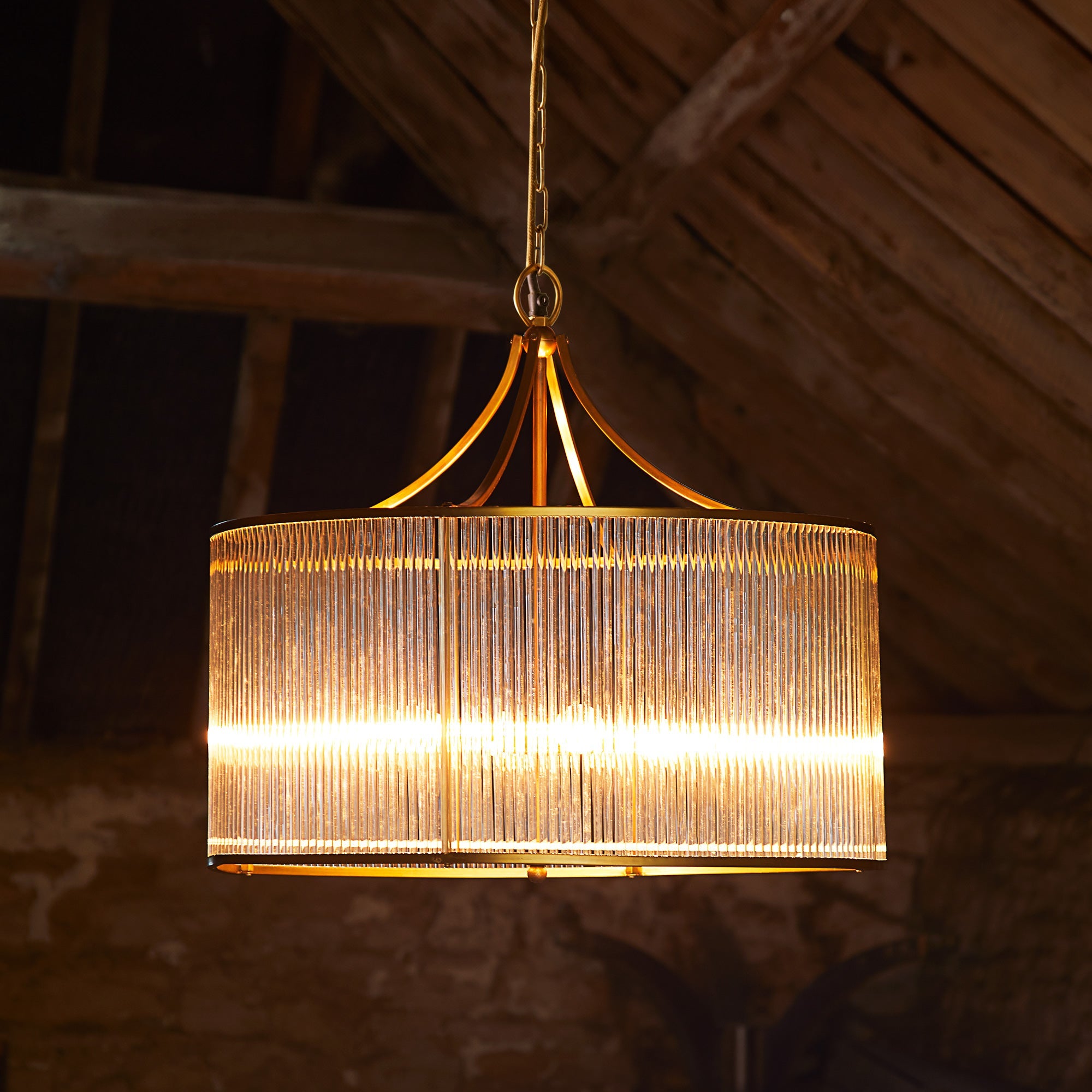 Artemis circular chandelier in brass with glass rods and frosted glass baffle