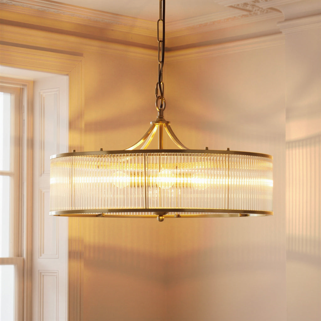 Athena Chandelier in brass with glass rods and frosted glass baffle